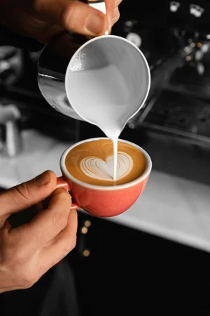 close-up-hand-pouring-milk
